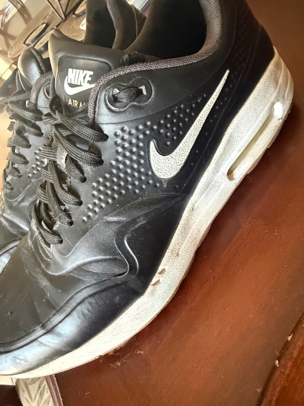 Nike Men’s Black Sneakers with White Swoosh